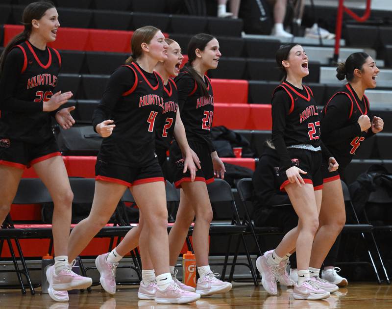 Players on the Huntley bench celebrate a teammate’s basket during a game against Prospect, which was played at Forest View Educational Center on Saturday, Jan. 4, 2025 in Arlington Heights.