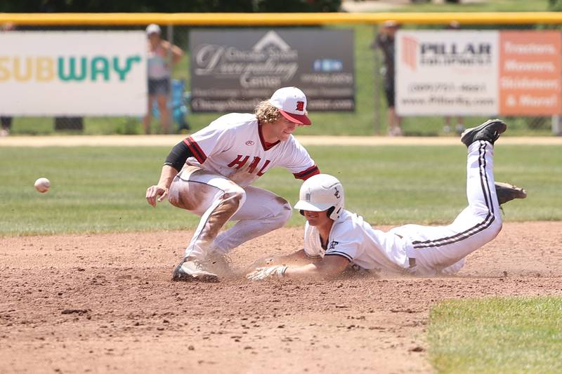 Spring Valley Hall’s Mac Resetich can’t field the throw as Joliet Catholic’s Zach Pomatto slides into second in the Class 2A Geneseo Supersectional on Monday, May 29, 2023 in Geneseo.