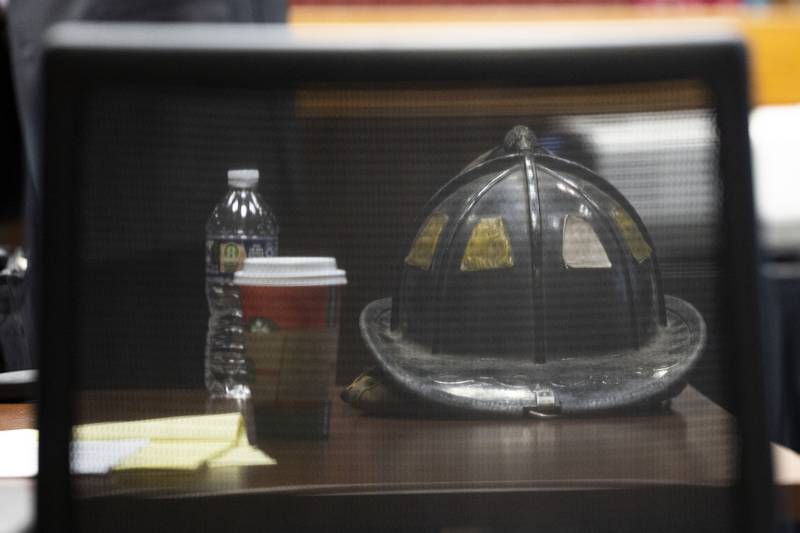Garrett Ramos’ firefighting helmet sits in the desk of the plaintiff Friday, Nov. 14, 2025, during his wrongful death trial in Whiteside County Court.