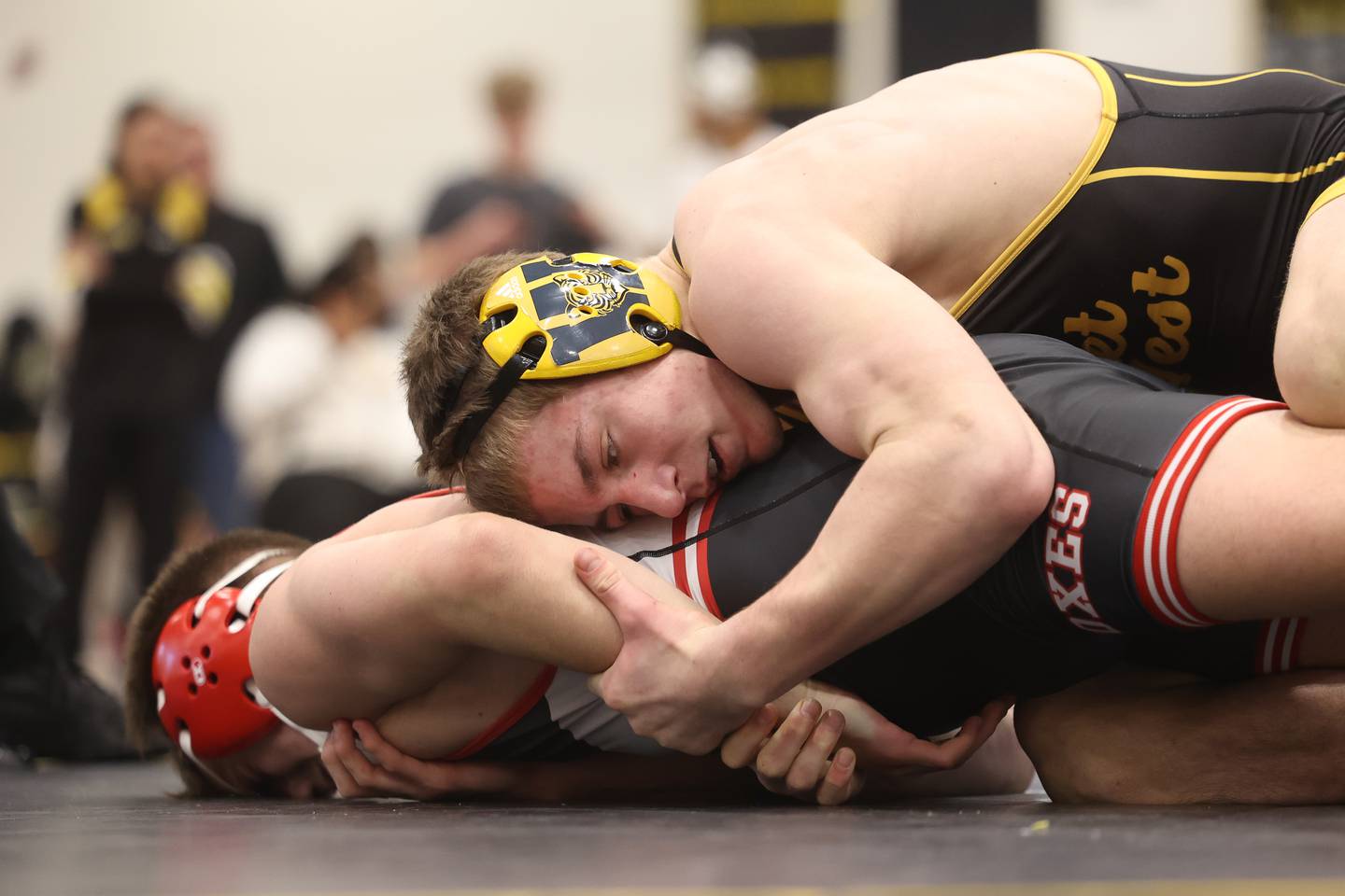 Joliet West’s Carson Weber works over Yorkville’s Donovan Rosauer in the 150-pound weight SPC Conference championship match at Joliet West on Saturday, Jan 25, 2025.