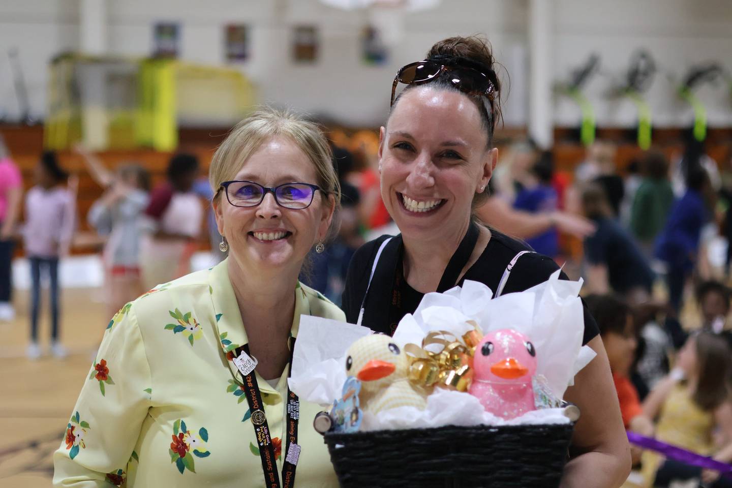 Ashley Carlson, fifth grade teacher at Malta Elementary School in DeKalb, ooses with school principal Kristine Baccheschi (left) as she's announced as the 2026 Wirtz Award winner for excellence in education during a surprise school assembly on April 24, 2026.