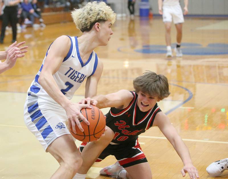 Princeton's Landon Roark secures a rebound as Hall's Greyson Bickett tries to knock the ball free on Friday, Jan. 26, 2024 at Princeton High School.