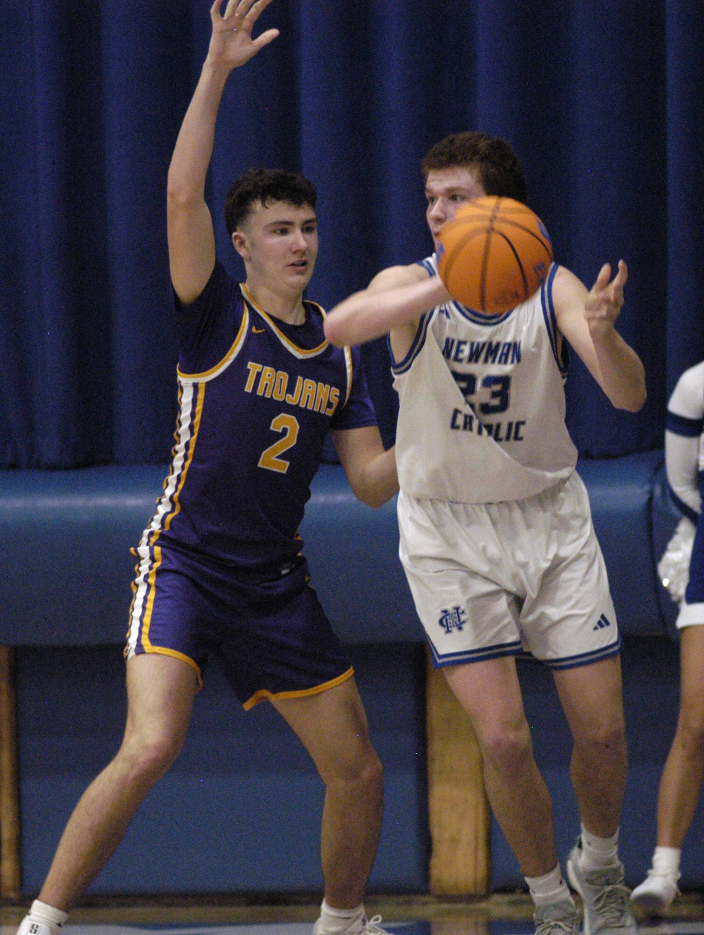 Newman's John Rowzee takes a rebound from Mendota's  Drew Becker. The Newman Comets defeated the Mendota Trojans 67-66 at Newman High School in Sterling. The game took place on Tuesday, January 13, 2025.