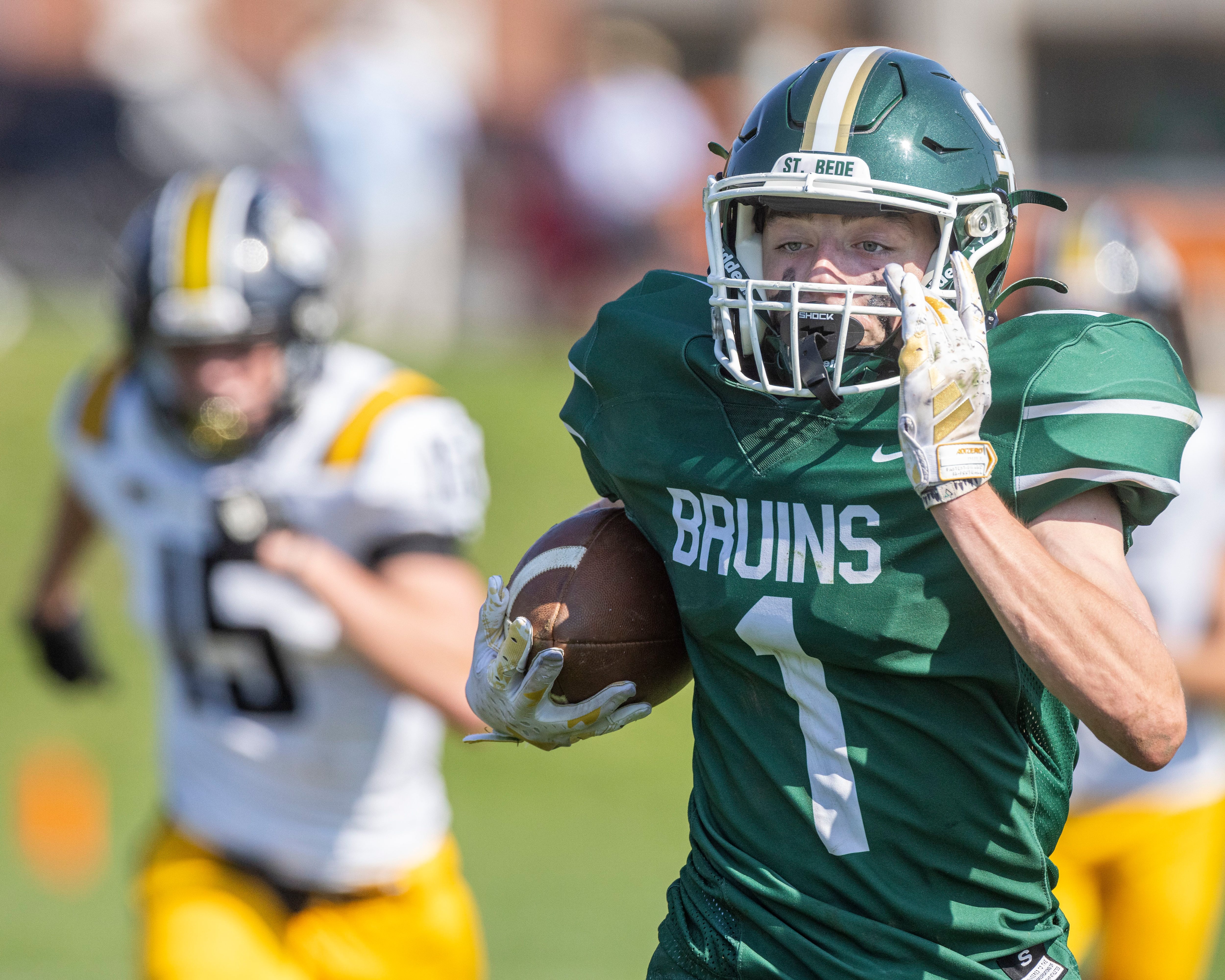 Alex Ankiewicz of St. Bede Academy runs the football down field for a large gain of yards against the Elmwood Park Tigers on September 30, 2023.