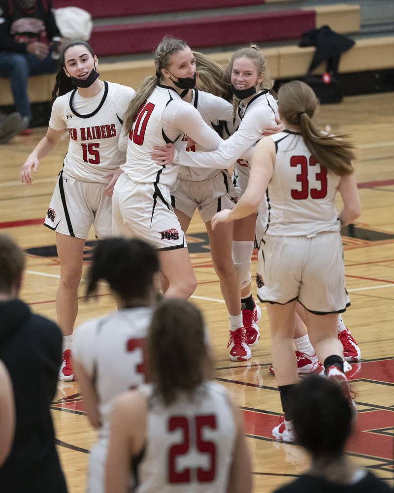 Huntley girls basketball players celebrate their win against Burlington Central on Saturday, January 29, 2022 at Huntley High School. Huntley won 52-49.