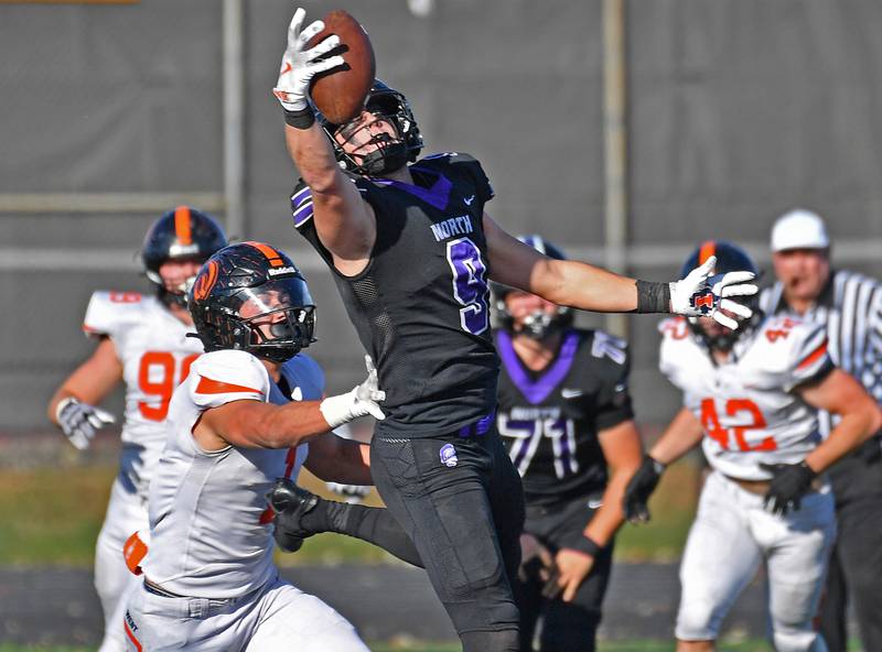 Downers Grove North’s Will Vala (9) make a one handed catch during a Class 7A quarterfinal game against Lincoln-Way West on November 15, 2025 at Downers Grove North High School in Downers Grove .