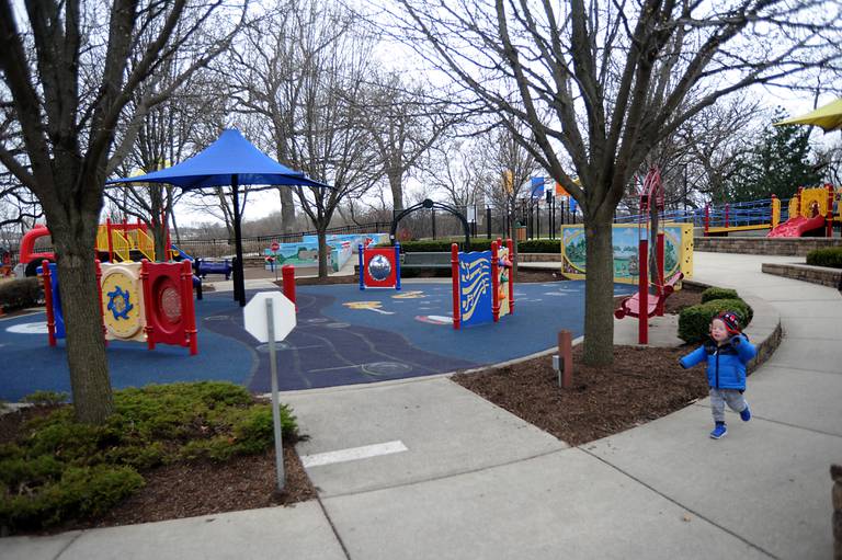 Ethan Underwood, 2, of Huntley, runs around the playground Wednesday, April 20, 2022, at he plays at Deicke Park in Huntley, which features an accessible playground. Woodstock plans on building an inclusive playground that is meant to be more accessible for children with handicaps or disabilities at Emricson Park.