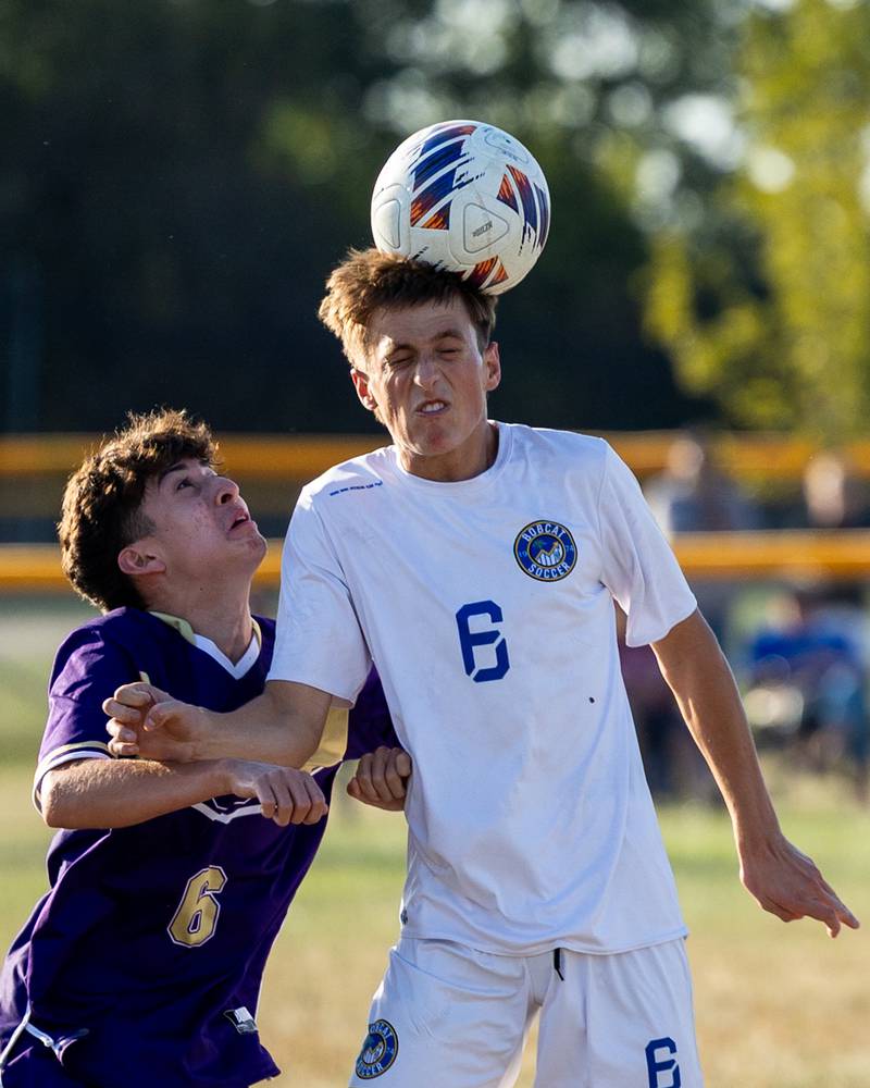 Damien Gonzalez (6) of Serena watches on as Karter Nelson (6) of Somonauk/Leland/Newark headers ball on Monday, Sept. 29, 2025, at Serena High School in Serena.