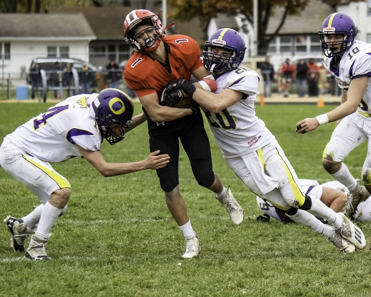 Amboy-LaMoille's Kye Koch (1) hangs on to the ball as Orangeville's Gunar Lobdell (20) tris to strip it during their 8-man semifinal playoff game Saturday, Nov. 13, 2021 at The Harbor in Amboy.