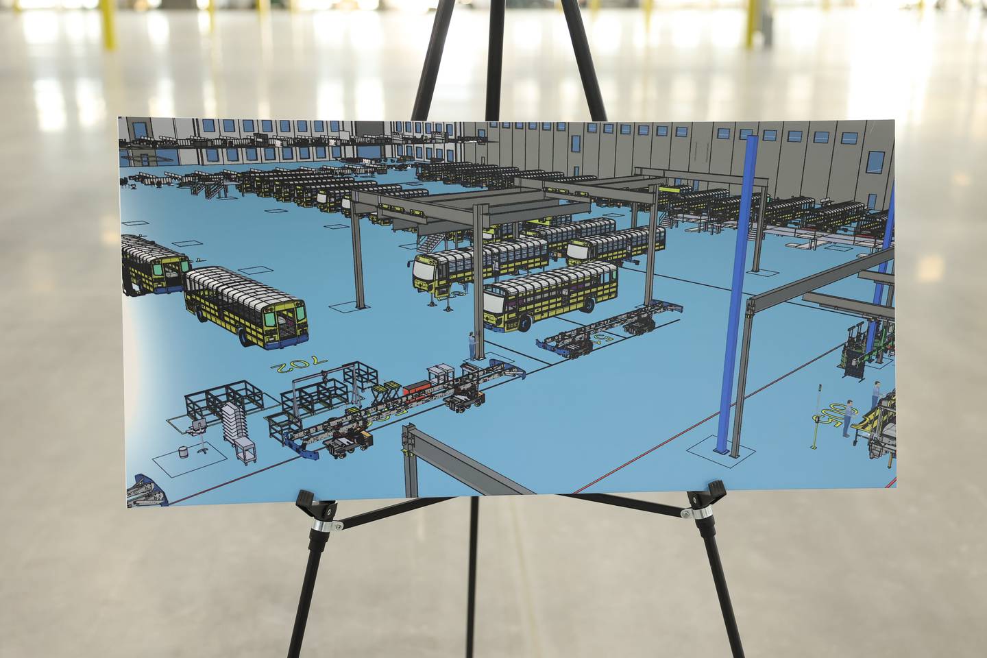 Artist renderings of the Lion Electric assembly lines are displayed throughout the plant during a press conference and interactive tour the new manufacturing facility.. Monday, Mar. 21, 2022, in Joliet.