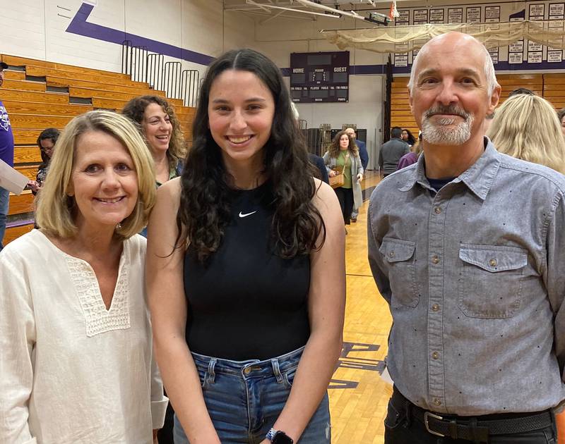 Jill and Matt Kuebrich prsented Plano High School senior Sasha Helfgott-Waters, center, with the 12th annual Andrew Kuebrich Memorial Scholarship on May 17, 2023.