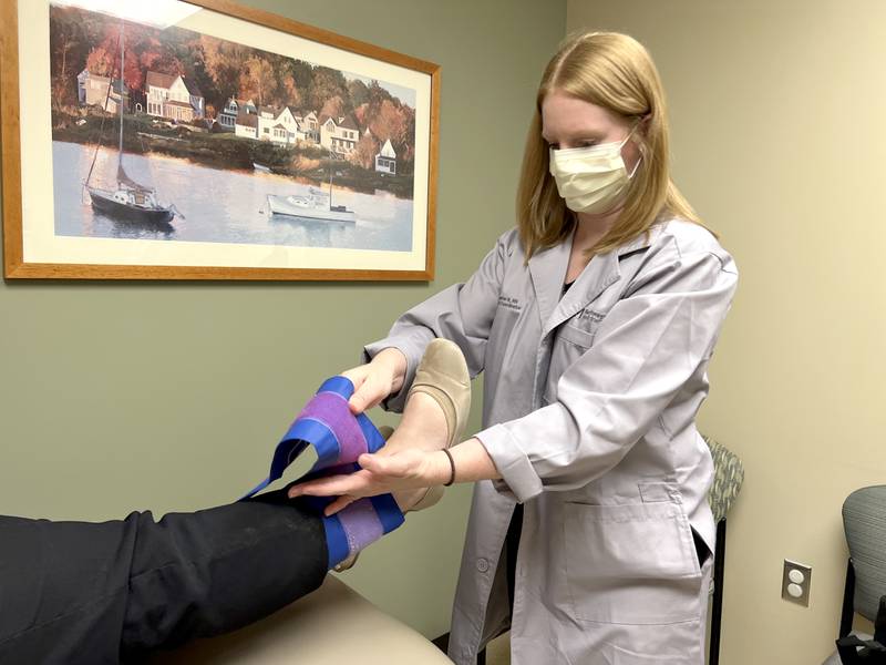 Jennifer Kerr, BSN, RN-BC, Bluhm Cardiovascular Institute Clinical Coordinator, demonstrates a PAD screening on Krysten Bortner BSN, RN,Bluhm Cardiovascular Institute Clinical Program Manager at Northwestern Medicine Central DuPage Hospital in Winfield.