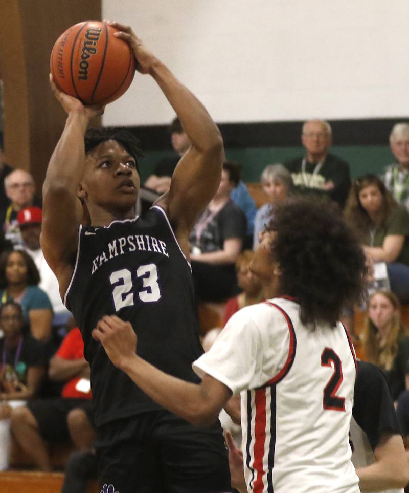 Hampshire’s Adrien Ugochukwu shoots the ball over Huntley's Omare Segarra during the boy’s game of McHenry County Area All-Star Basketball Extravaganza on Sunday, April 14, 2024, at Alden-Hebron’s Tigard Gymnasium in Hebron.