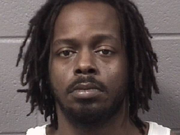 DeKalb man charged after police say they found him asleep inside his car with loaded gun