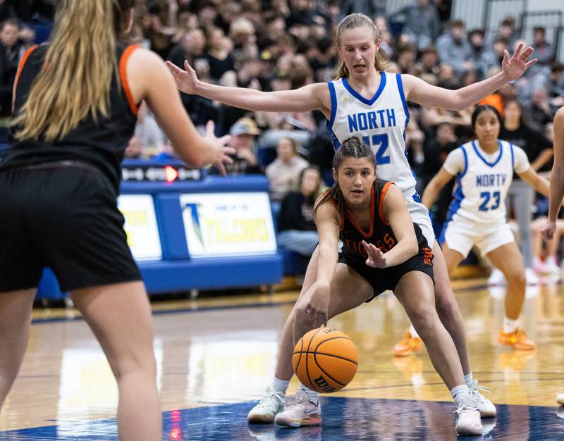 Wheaton Warrenville South’s Ellie Pinto passes the ball to a teammate during a game against Wheaton North at Wheaton North High School on Friday, Dec. 20, 2024.