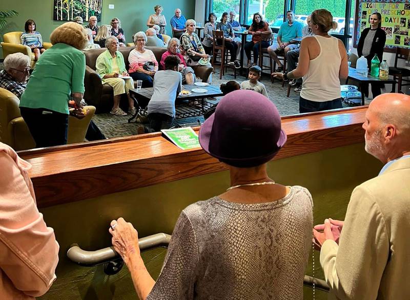 Heather Shore, judge for Woodlawn Arts Academy’s 14th annual Juried Art Exhibit, presents awards at the opening reception in late August.