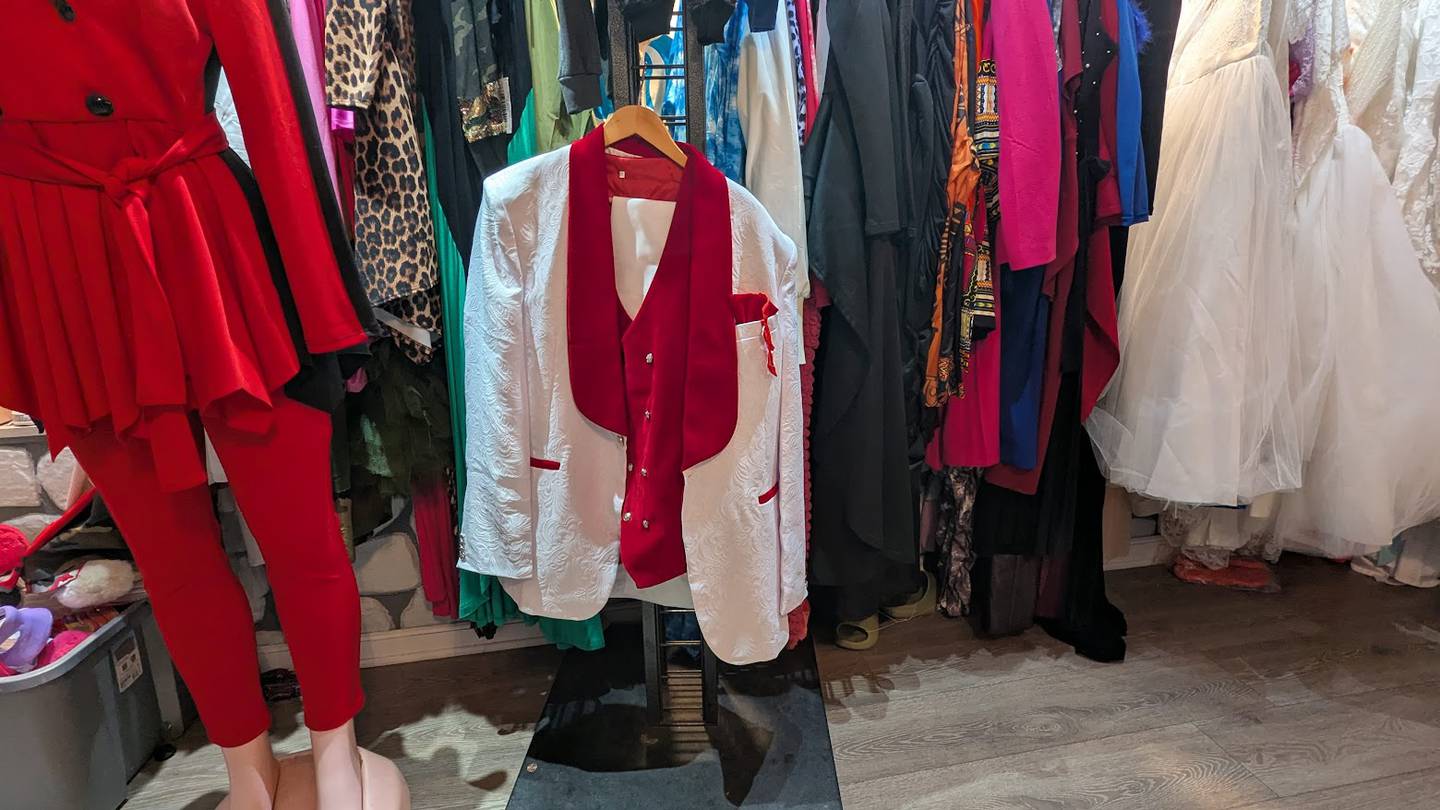 Fashionable clothing hangs from racks at Candy Kouture in Joliet, including a jacket Moore designed, on Tuesday, Feb. 25, 2025.