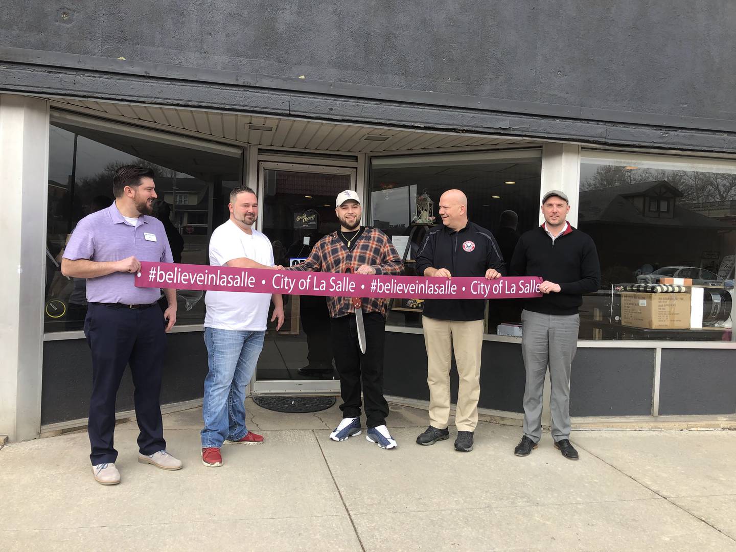 Owners of KP Resale in downtown La Salle celebrate a ribbon cutting ceremony with city officials to announce the grand opening Wednesday, March 1 at 229 Gooding Street.