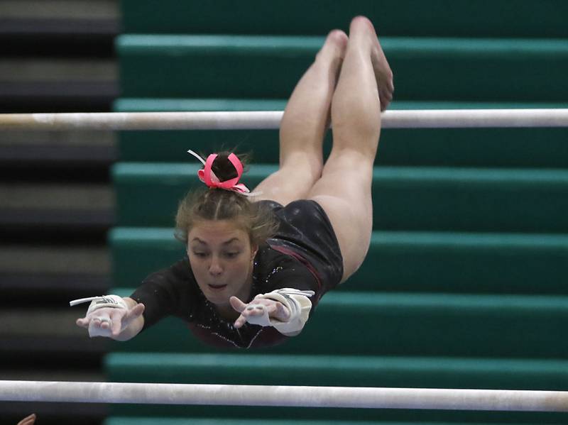 Prairie Ridge’s Gabriella Riley competes in uneven parallel bars Wednesday, Feb. 8, 2023, during  the IHSA Stevenson Gymnastics Sectional at Stevenson High School in Lincolnshire.