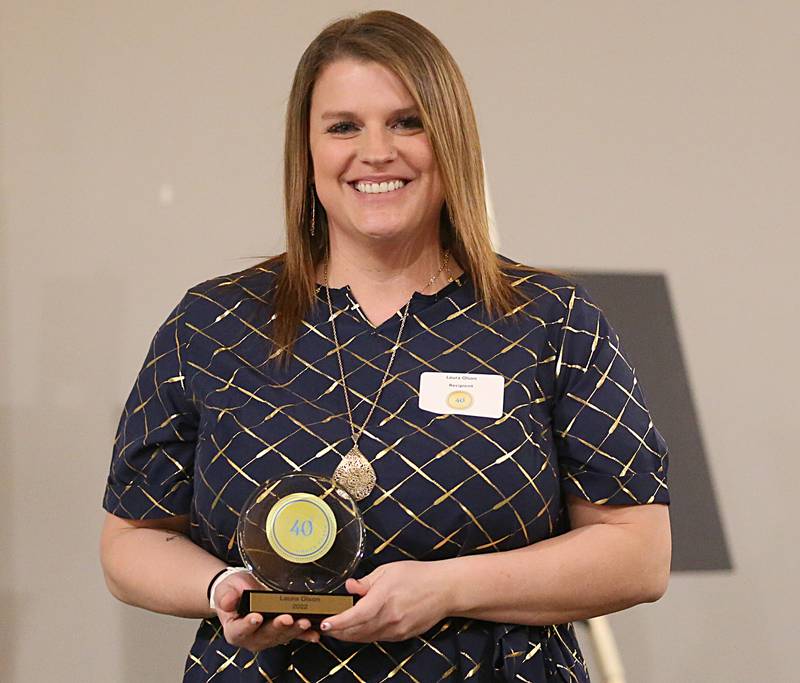 Laura Olson, Business Service Representative, Business Employment Skills Team, Inc poses for a photo with her award during the Illinois Valley Chamber of Commerce 40 Under Forty Awards Gala on Thursday, Feb. 9, 2023 at Westclox in Peru.