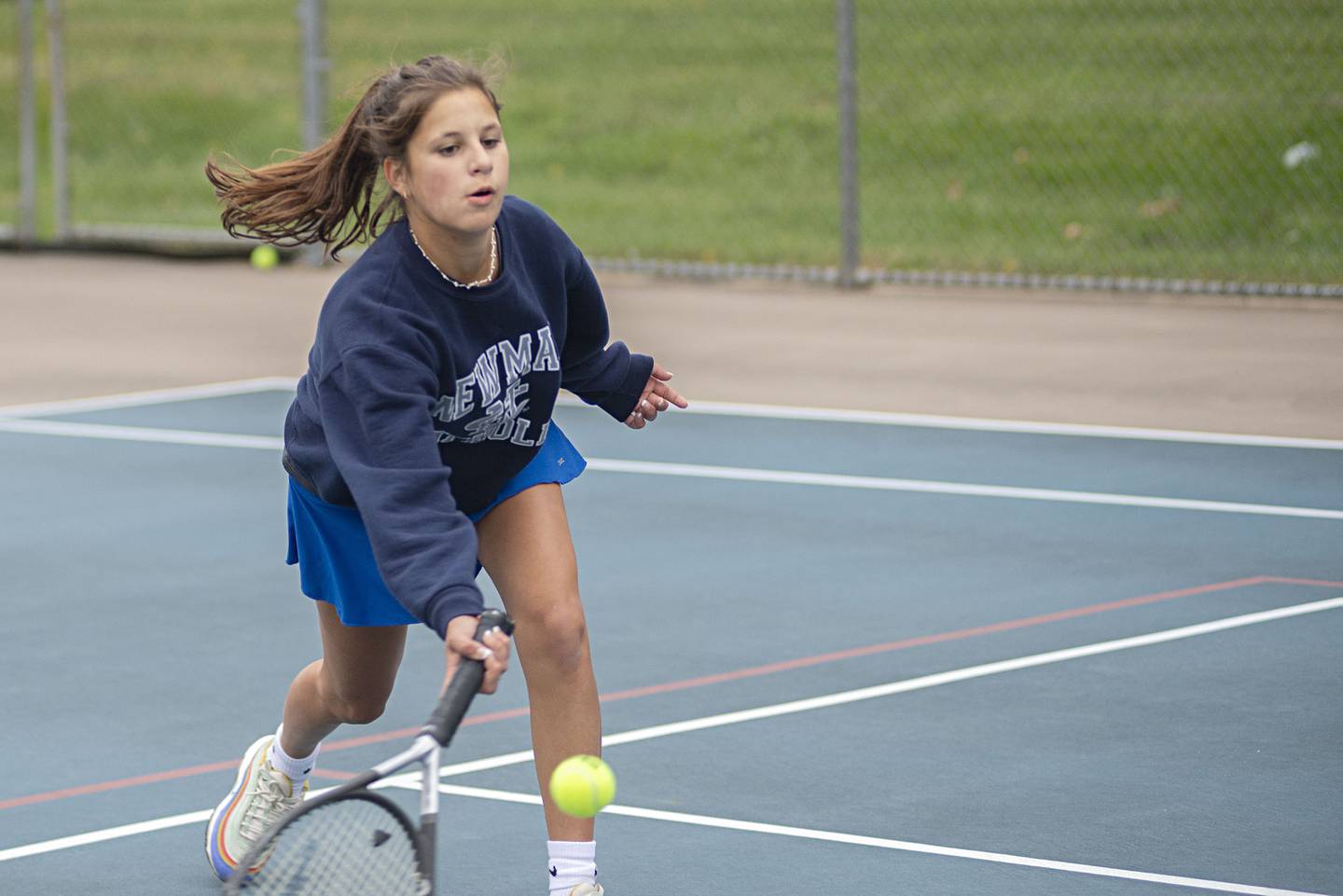 Newman’s Emmy Burger returns a shot while playing doubles against Dixon Thursday, Oct. 6, 2022.