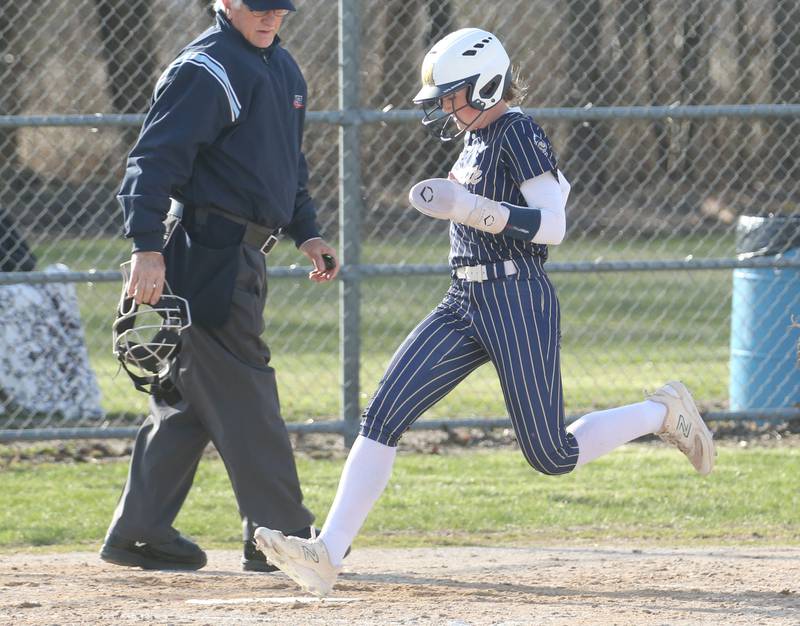Marquette's Hunter Hopkins steps on home plate to score a run against Serena on Wednesday, March 26, 2025 at Serena High School.