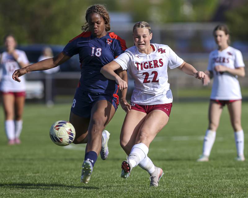 Oswego's Jordyn Washington (18) battles Plainfield North's Ellie Bearden (22) during a soccer match between Plainfield North at Oswego on Monday, May 11, 2026 in Oswego.