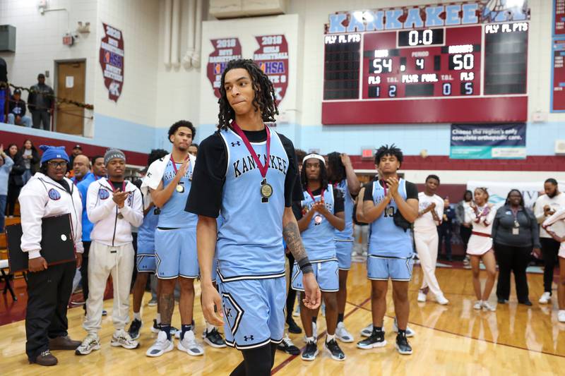 Kankakee's Lincoln Williams smiles as he steps forward to receive the game ball after breaking the school's career scoring record during the 75th Kankakee Holiday Tournament maroon bracket championship on Sunday, Dec. 28, 2025.