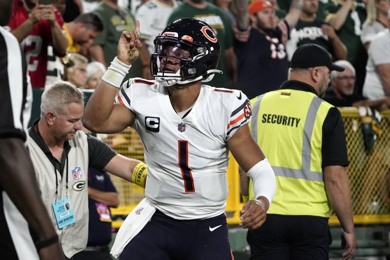 Chicago Bears quarterback Justin Fields celebrates after scoring on a 3-yard touchdown run during the first half against the Green Bay Packers, Sunday, Sept. 18, 2022, in Green Bay, Wis.