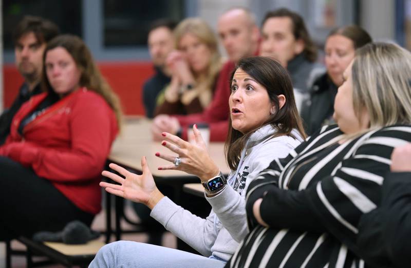 Kelly Hardesty, a teacher and parent of a student in Sycamore Community School District 427 asks a question of district superintendent Steve Wilder Monday, Jan. 9, 2023, during a public meeting hosted by the district at North Grove Elementary School. The forum was held to get staff and community feedback on a plan that could change the district boundaries causing some students to have to switch elementary schools inside the district as early as next year.