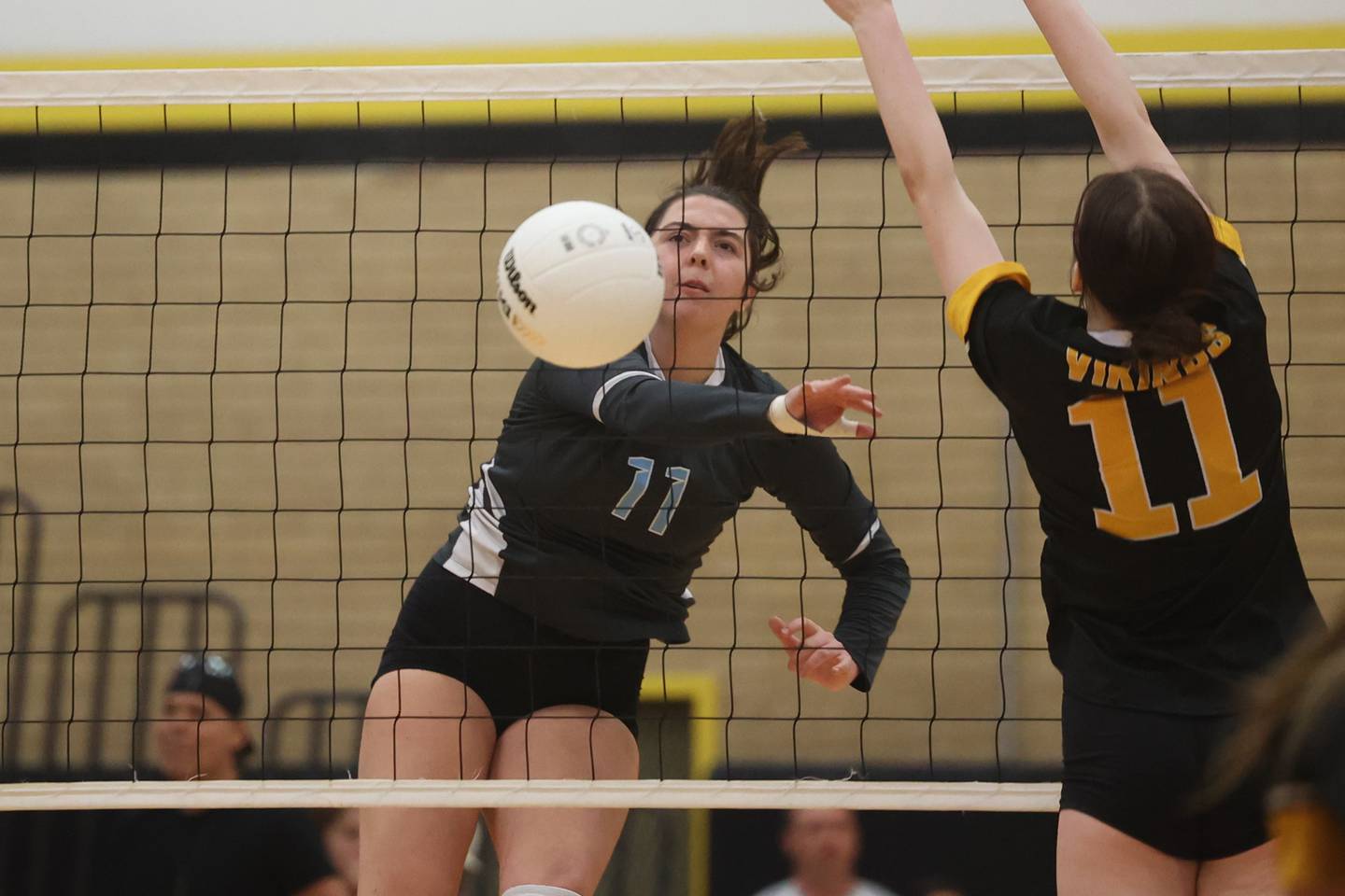 Joliet Catholic’s Ava Neuschwander eyes her shot fall for a point against St. Laurence in the Class 3A Hinsdale South Super-sectional on Friday