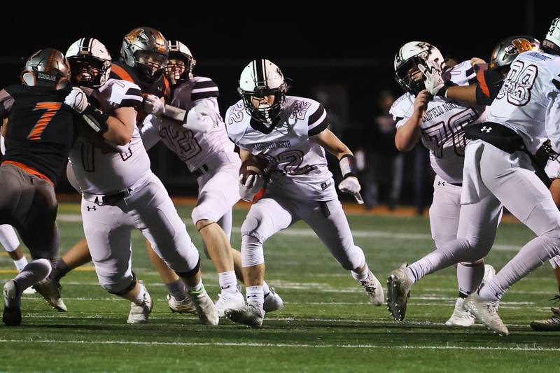 Plainfield North’s offensive line make a hole John St. Clair against Minooka. Friday, Oct. 7, 2022, in Minooka.