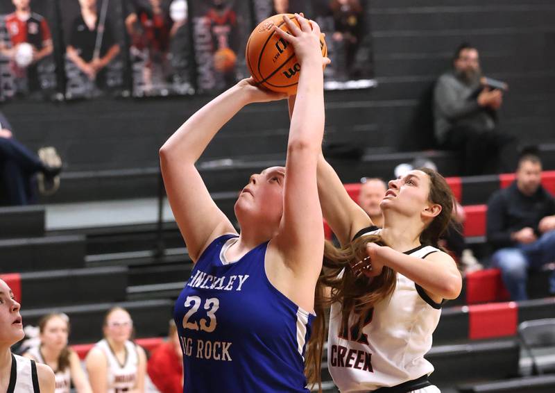 Hinckley-Big Rock's Sami Carlino gets a shot up in front of Indian Creek's Isabella Turner during their game Monday, Jan. 13, 2025, at Indian Creek High School in Shabbona.