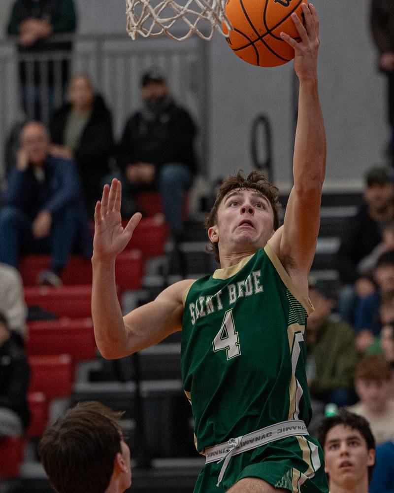 St. Bede's Gino Ferrari (4) lays ball up during game against Hall on Saturday, January 31, 2026 at Hall High School in Spring Valley.