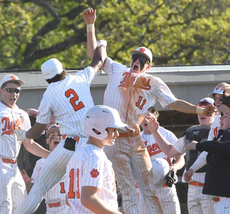 Byron's JJ Edmonson (2) celebrates his home run with Weston Auker (11) during a Monday, May 11, 2026 Big Northern Conference game in Byron.