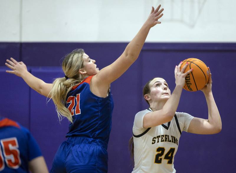 Sterling’s Madison Austin puts up a pass against Eastland’s Olivia Klinefelter Thursday, Dec. 26, 2024, during the Dixon Girls Holiday Basketball Tournament.
