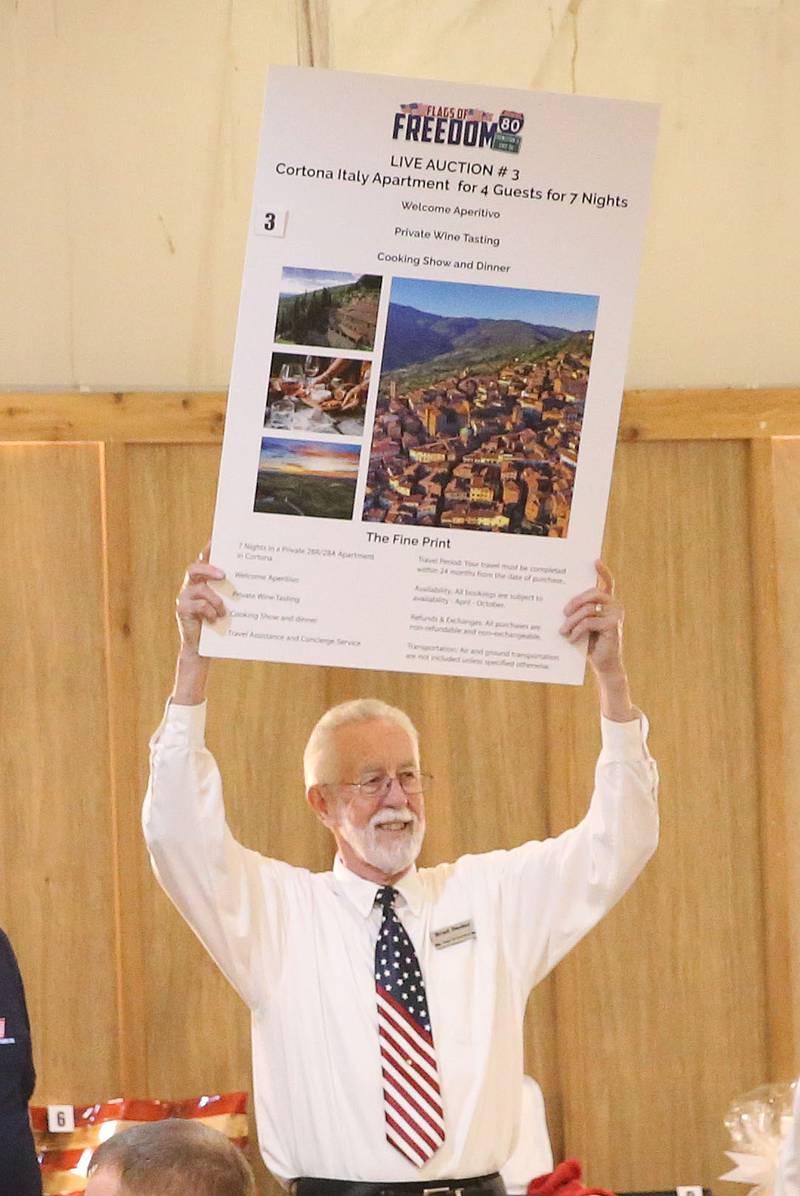 Brad Oeder holds a live auction trip to Italy during the Flags of Freedom 1-80 Star Spangled 20 Year Anniversary celebration on Saturday, April 5, 2025 at the Hundred Acre Orchard in Princeton.