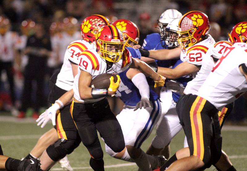 Batavia’s Zach Granberg carries the ball through the middle during a game at Geneva on Friday, Sept. 29, 2023.