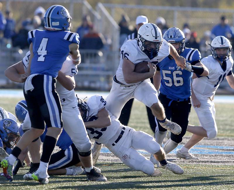 Cary-Grove's Logan Abrams breaks through the Lake Zurich line during a IHSA Class 6A semifinal playoff football game on Saturday, Nov. 18, 2023, at Lake Zurich High School.