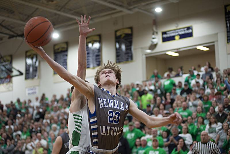 Newman's Lucas Simpson puts up a shot against Scales Mound in the sectional final Friday, March 4, 2022.