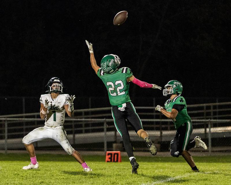 Jose De Le Torre (1) of St. Bede looks to catch pass by quarterback Gino Ferrari (8) as Brayden Simek (22) of Seneca tries to intercept on Friday, Oct. 10, 2025 at Seneca High School in Seneca.