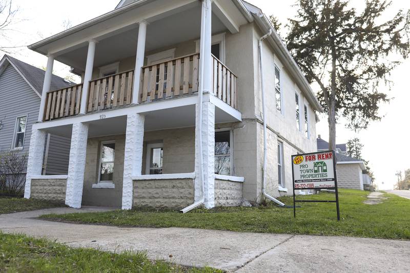 A "For Rent" sign sits outside a house on Friday, April 16, 2021, in Joliet, Ill.