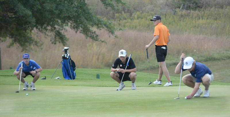 Byron's Landon Smith (center) waits to putt during the 1A Pearl City Regional on Wednesday, Oct. 1, 2025 at Wolf Hollow Golf Course in Lena.