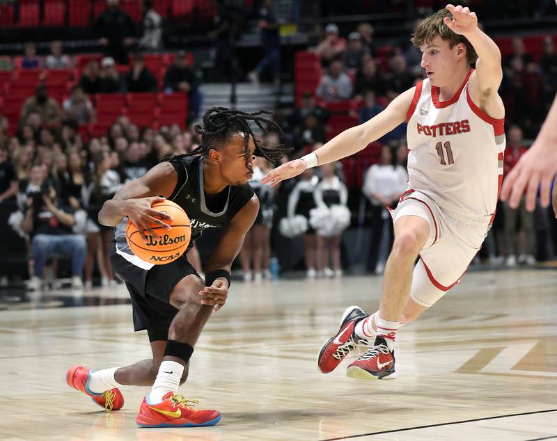 Kaneland's Marshawn Cocroft puts a move on Morton's Owen Adams Monday, March 9, 2026, during their IHSA Class 3A supersectional matchup in the Convocation Center at Northern Illinois University in DeKalb.