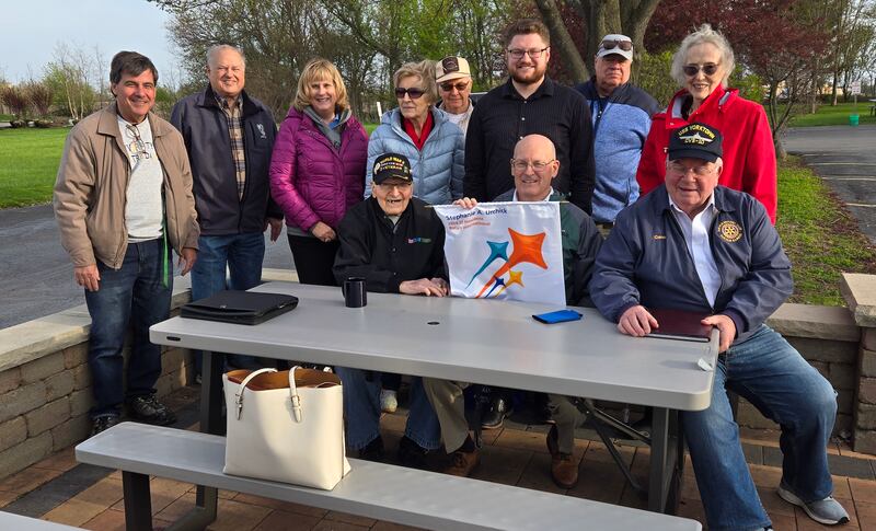 (From left) Pictured at Ollie's Frozen Custard in DeKalb with the DeKalb's newest Rotary member is 100-year-old Army Veteran Paul Carlson, Dr. Dwyer, John Horn, President Christine Johnson, Paul Carlson, Secretary Maria Krull, Sunrise President Norm Walzer, past President Christopher Boyes, Mike Coghlan, Vince Boone, Gene Deisz (retired), and Elizabeth Simon.