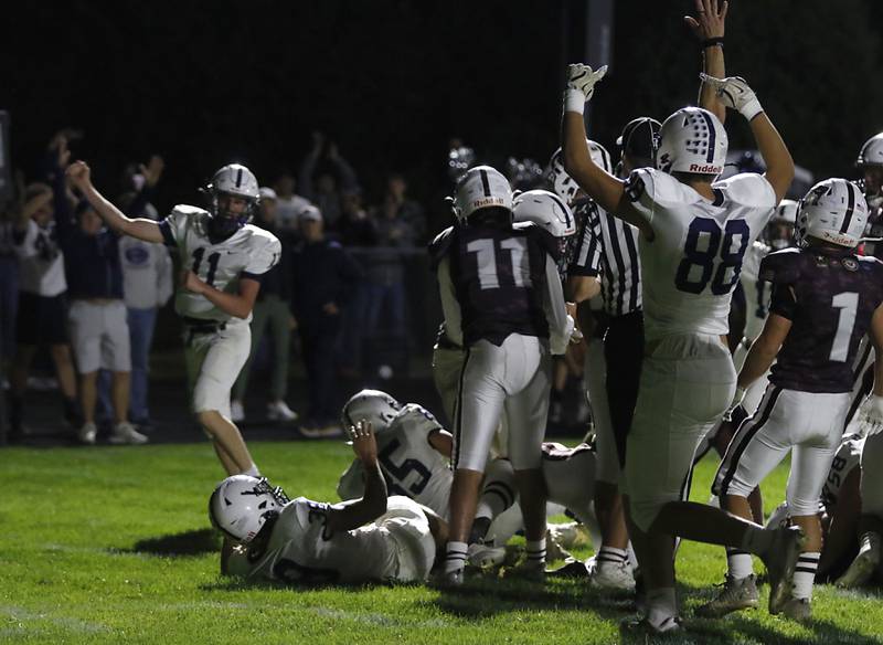 Cary-Grove's Peyton Seaburg (left) and Cary-Grove's Quintin Witt celebrate their winning touchdown during a Fox Valley Conference football game Prairie Ridge on Friday, Sept. 27, 2024, at Prairie Ridge High School.