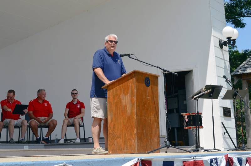 Mt. Morris Village President Phil Labash speaks from the Warren G. Reckmeyer Bandshell's stage during the annual Let Freedom Ring patriotic program on July 4, 2023. The hour-long program started at noon, when the heat index was around 93 degrees.