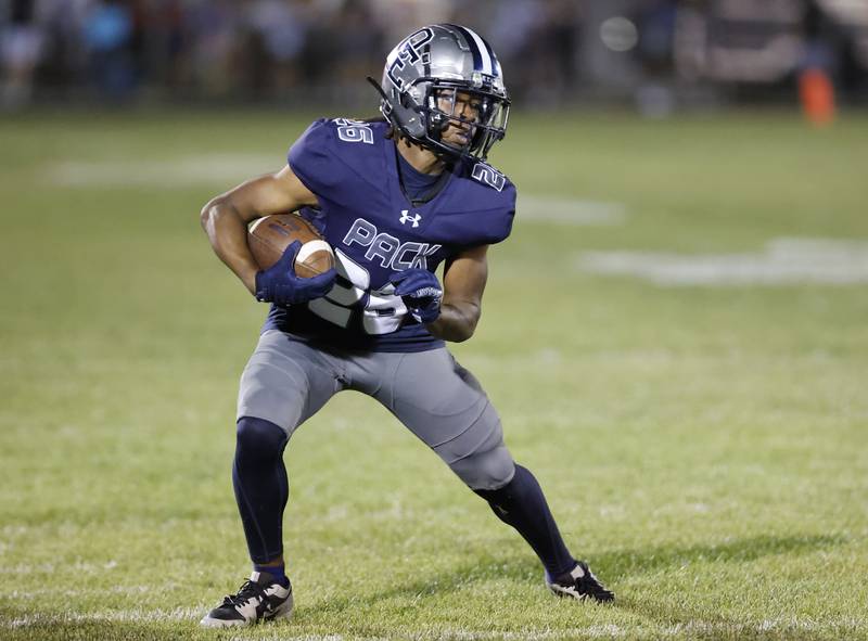 Oswego East's Ty'rei Thomas (26) runs with the ball during the varsity football game between Plainfield South and Oswego East on Friday, Sep. 20, 2024 in Oswego.
