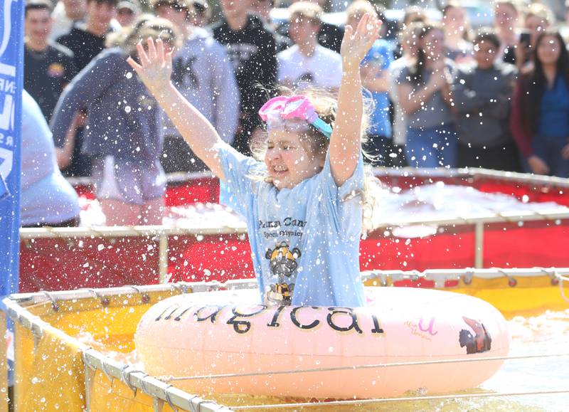 Putnam County High School student Makayla Wiley, reacts to the cold water while jumping a water tank during the Polar Plunge to support Special Olympics on Friday, March 14, 2025 at Putnam County High School.