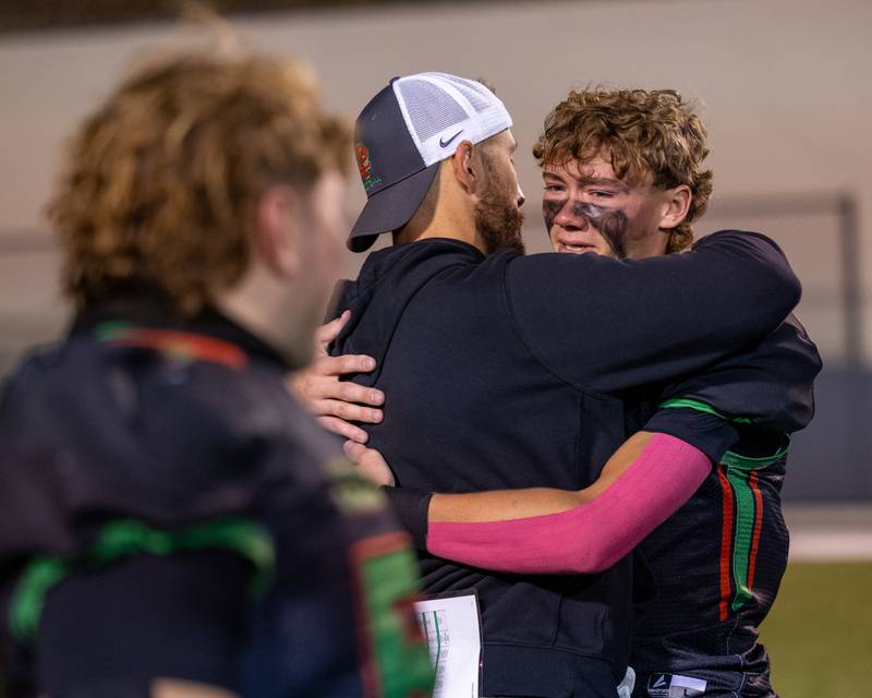 Regan Doerr (5) of L-P hugs Head Coach JJ Raffelson after loss to O’ Fallon on Friday, October 24, 2025 at Howard Fellows Stadium in LaSalle.